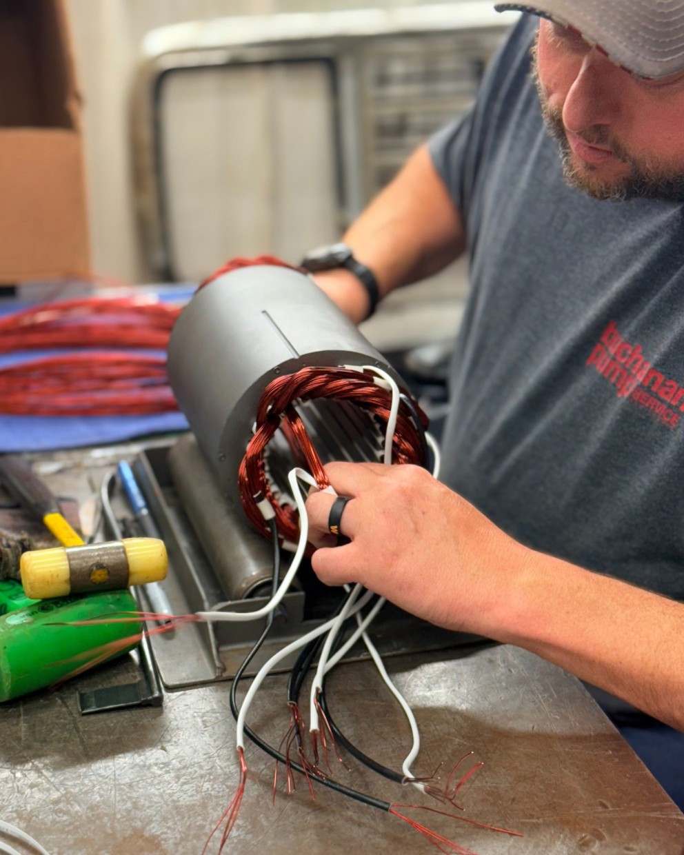 person working on pump assembly