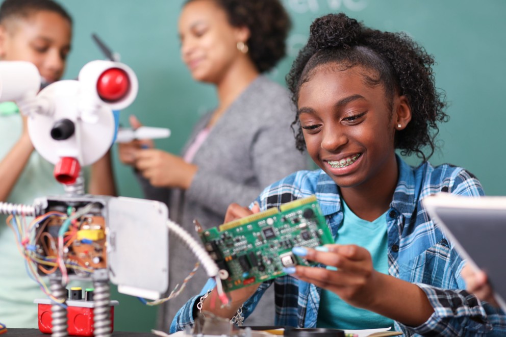 girl working on electronics