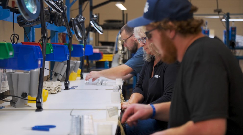technicians on assembly line